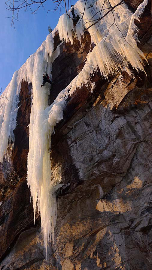 Peter Doucette following the ice pitch. The first pitch climbs overhanging rock from the right.  The icicle was in unusually fat condition  1/6/10