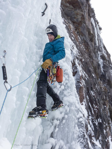 Ben Maxfield plays it safe by putting in another screw off the belay while leading on Called on Account of Rains (WI5+) at Lake Willoughby in Vermont.